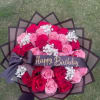 Bouquet of pink and red roses with a Happy Birthday ribbon