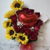 Bouquet of red roses and yellow sunflowers with a red heart balloon