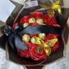Bouquet of red satin roses with Ferrero Rocher chocolates and gold butterfly picks