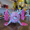 Hello Kitty party piñata with pink tassels and iridescent cones