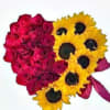 Heart-shaped bouquet of red roses and yellow sunflowers with a pink ribbon