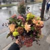 This bouquet carries warmth and resilience &mdash; soft peaches and honey tones