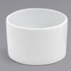 A modern white ceramic vase chosen to complement our garden-style bouquets. Vase