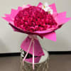 100 Long-stem roses + 1 stem of orchids in our Signature wrap