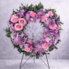 A soft circle of pastel blooms makes a quiet, heartfelt statement-this floral