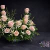 Pink roses, babies breathe and greenery for an Urn