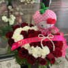 A great arrangemt,made of leather ,carnation , roses and a beautiful plushie