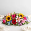 Colorful bouquet with sunflowers, roses, lilies, and gerbera daisies