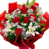 A bold and romantic hand-tied bouquet featuring classic red roses, elegant white