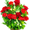 Red roses and carnations in a woven basket