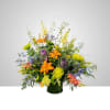Colorful mixed flower arrangement in a dark vase