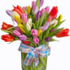 Celebrate the beauty of spring with our vibrant Tulip Jubilee arrangement. Featuring