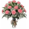 Pink carnations and baby's breath in a clear glass vase