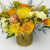 Yellow and orange bouquet in a gold vase