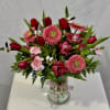 Spring fun bouquet with red Tulips, pink Gerberas, pink Carnations, and red