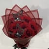 Wrapped bouquet filled with red Ecuadorian Roses.