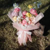 A soft and elegant mix of seasonal fresh flowers arranged in a