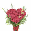 Heart-shaped bouquet of pink roses in a glass vase with a red ribbon