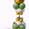 Clustered gold, green, and white balloons on a stand