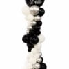 Black, white, and silver balloon column with a large printed top balloon