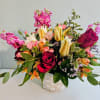 Deep red roses mingle with pale yellow-and-white lilies for an immediately romantic