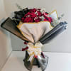 Deep, velvet-red roses gathered tight in a polished gift bouquet-this flower arrangement
