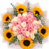 Bouquet of pink and cream roses with sunflowers and baby's breath