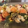 Peach and cream rose bouquet with yellow-red daisies and berry accents