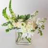 This arrangement is a masterclass in monochromatic elegance, with a design that