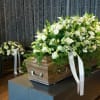 Full casket with a variety of flowers design