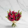 A vibrant and elegant bouquet featuring rich shades pink and magenta blooms