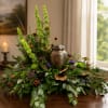 A graceful, sculptural sympathy arrangement built around tall spikes of Bells of
