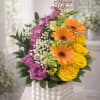 A vertical sweep of purple roses meets a sunny cluster of yellow