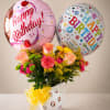 A playful cluster of pink roses, carnations, and bright yellow filler blooms