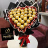 Bouquet of gold-wrapped chocolates with black and red wrapping