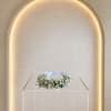 A light halo of baby's breath shaped into a delicate floral ring