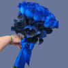 A dense cluster of vivid blue roses creates an immediate, dramatic impression-this