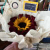 red Roses with sunflower. color paper is designed and chosen by florist