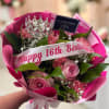 Pink rose and carnation bouquet with a birthday ribbon and crown