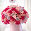 A round, satin-finish box featuring export-quality roses&mdash;deliberately selected in shades of fuchsia
