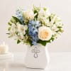 Offer comfort and heartfelt condolences with this elegant arrangement featuring white roses