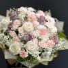 Whispering Blooms Bouquet is a delicate composition designed in a soft, romantic