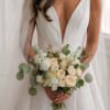 The Ivory Whisper Bridal Bouquet is a refined floral design inspired by
