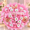 Pink rose bouquet with white daisies and a birthday ribbon
