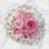Soft blush roses form a full, round bouquet that reads as a