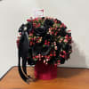 Boxed arrangement of roses in your choice of color, with coffee beans