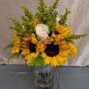 Bright, sunny sunflowers clustered around white roses to create a cheerful wedding