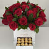 Red rose arrangement in a white box with a drawer of gold chocolates
