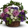 Lush flowers to celebrate a full life. This beautiful basket of flowers