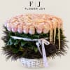 Large pastel rose arrangement in a white basket with ribbon